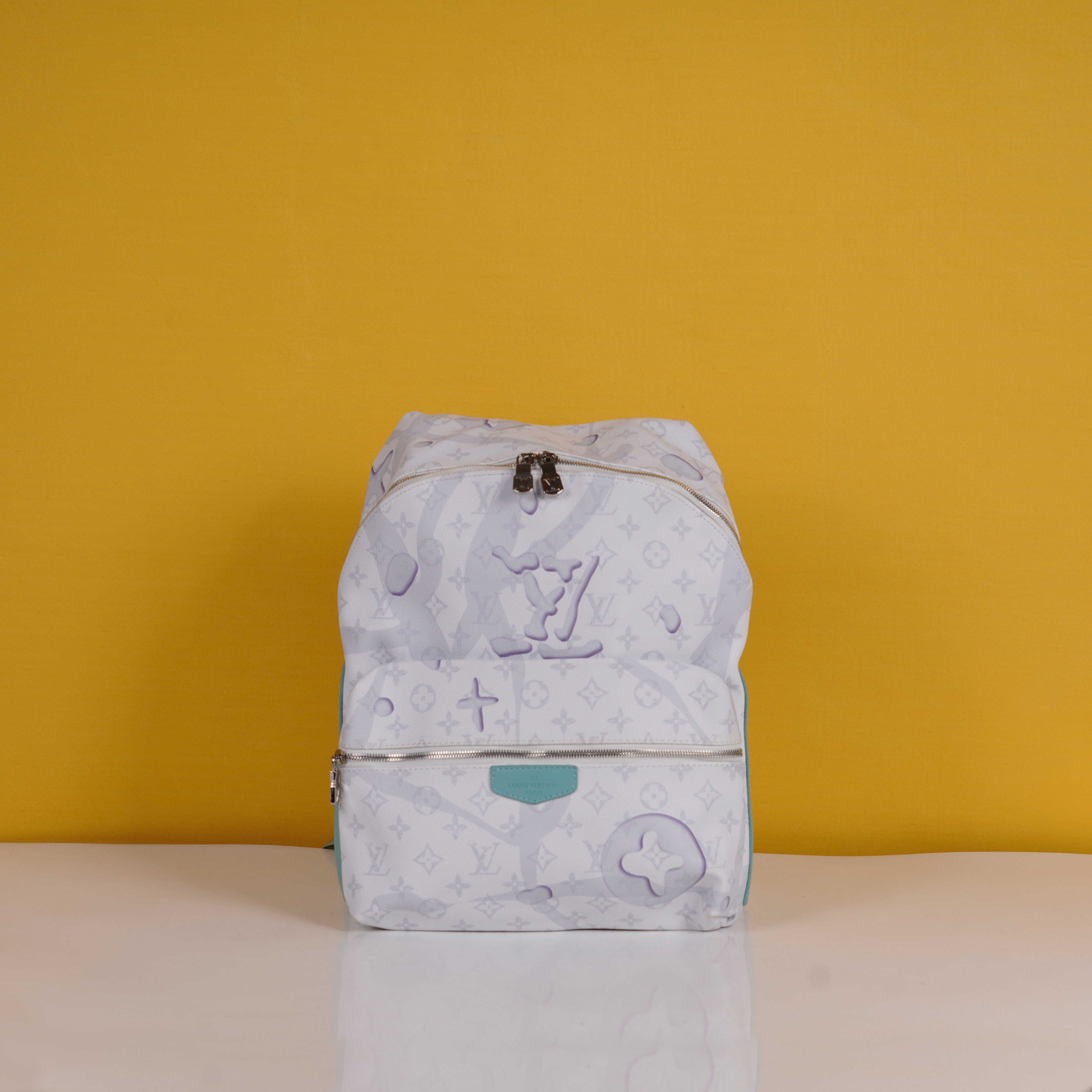 Discovery Premium Monogram Unisex Backpack With Dust Bag (White - 962)